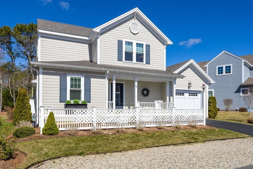 56 Cottage Lane Mashpee, MA 02649 - Photo 2 of 42 a front view of a house with a yard