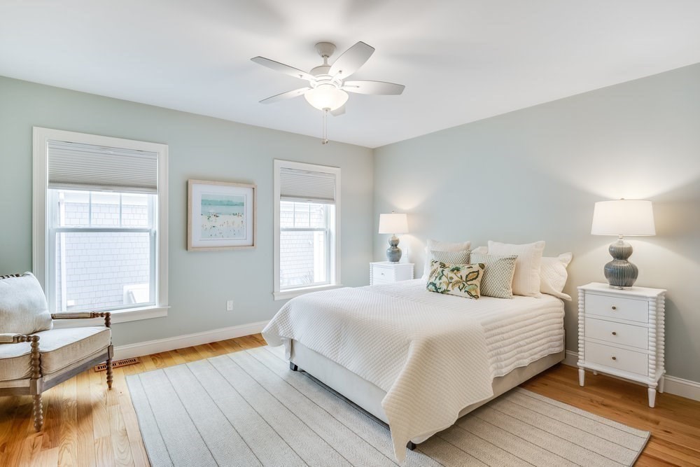 56 Cottage Lane Mashpee, MA 02649 - Photo 21 of 42 a bedroom with a large bed and a window