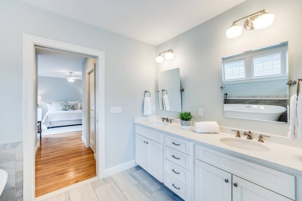 56 Cottage Lane Mashpee, MA 02649 - Photo 23 of 42 a bathroom with a double vanity sink and a mirror