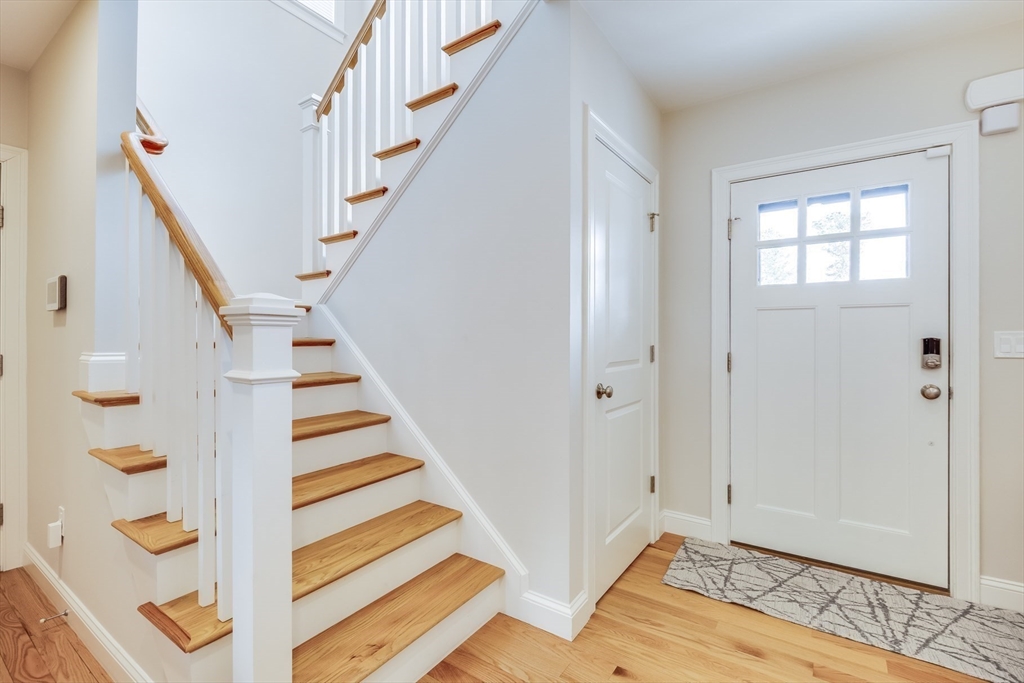 56 Cottage Lane Mashpee, MA 02649 - Photo 25 of 42 a view of entryway with wooden floor and stairs