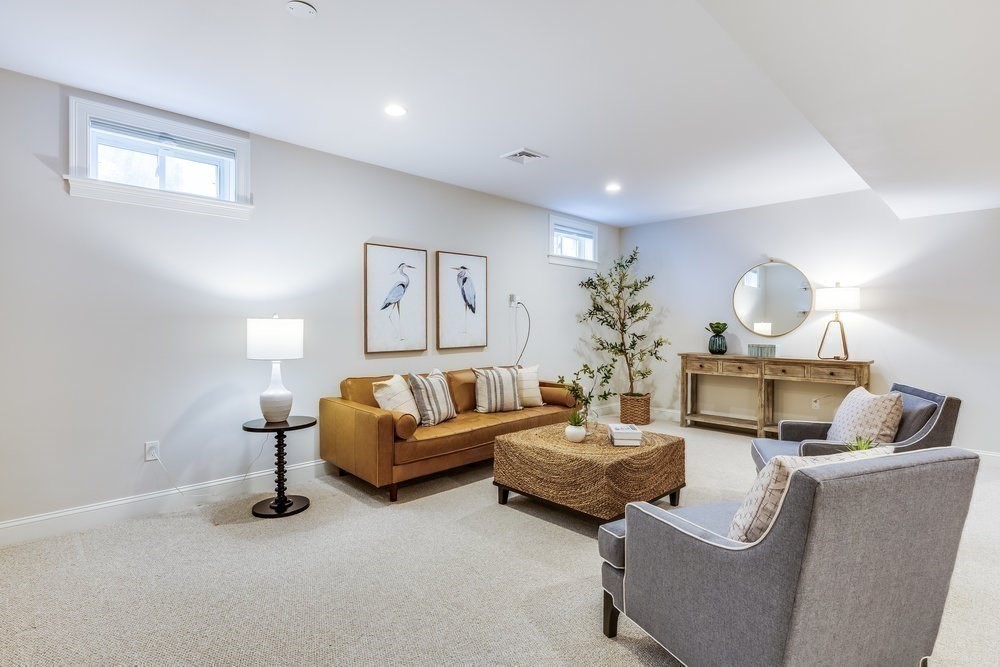 56 Cottage Lane Mashpee, MA 02649 - Photo 29 of 42 a living room with furniture and a lamp