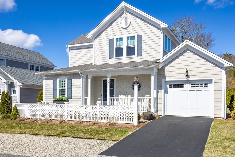 56 Cottage Lane Mashpee, MA 02649 - Photo 3 of 42 a front view of a house with a yard