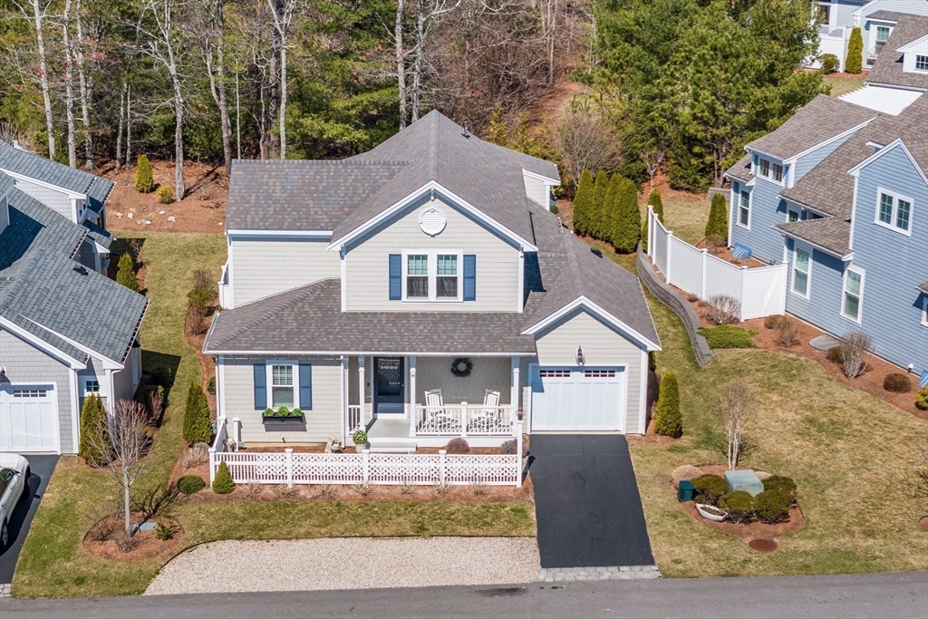 56 Cottage Lane Mashpee, MA 02649 - Photo 38 of 42 a front view of a house with swimming pool and sitting area