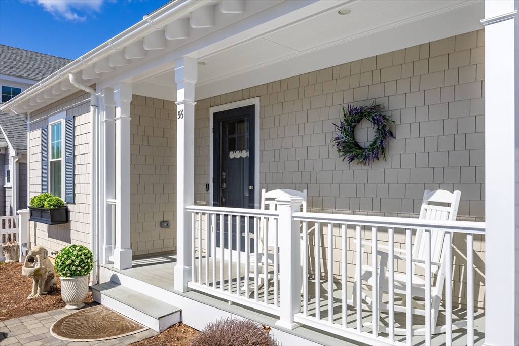 56 Cottage Lane Mashpee, MA 02649 - Photo 4 of 42 a view of a porch with a chairs