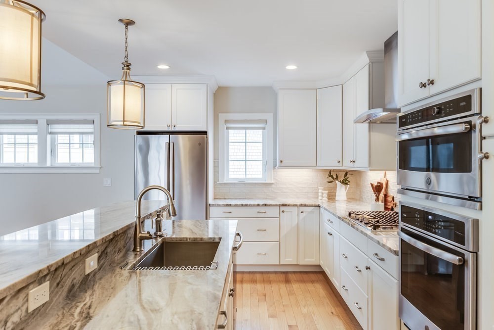 56 Cottage Lane Mashpee, MA 02649 - Photo 6 of 42 a kitchen with stainless steel appliances granite countertop a sink stove and refrigerator