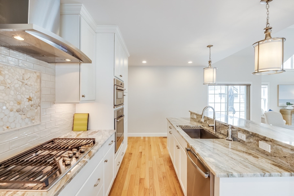 56 Cottage Lane Mashpee, MA 02649 - Photo 8 of 42 a kitchen with sink and cabinets