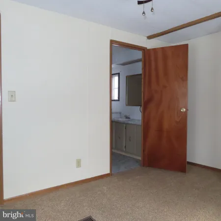 an empty room with a bathroom