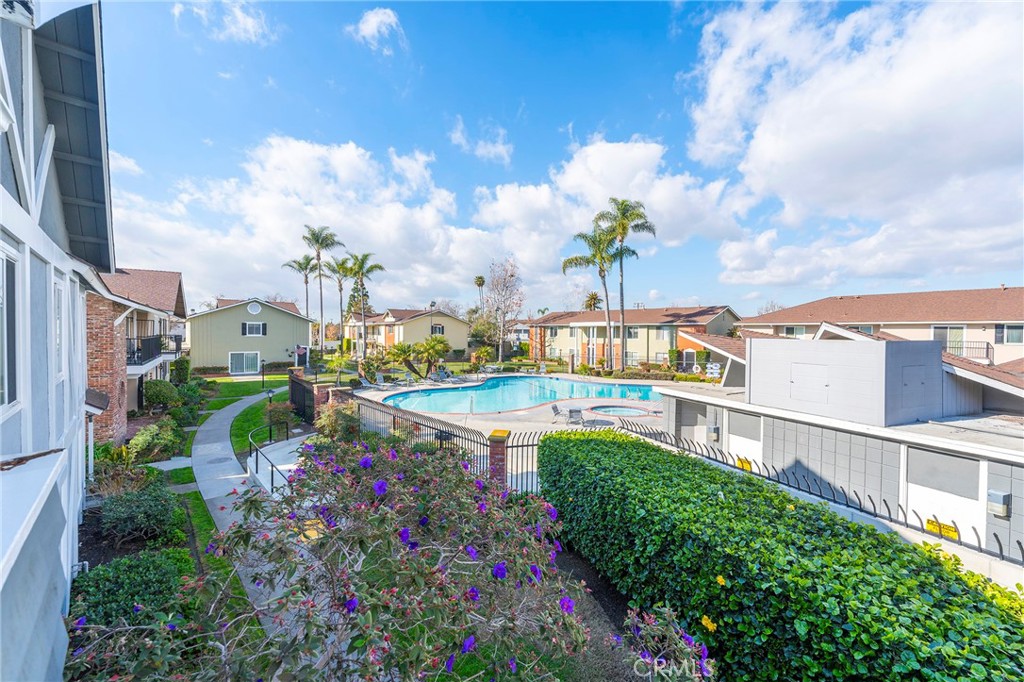 a view of a swimming pool with a yard
