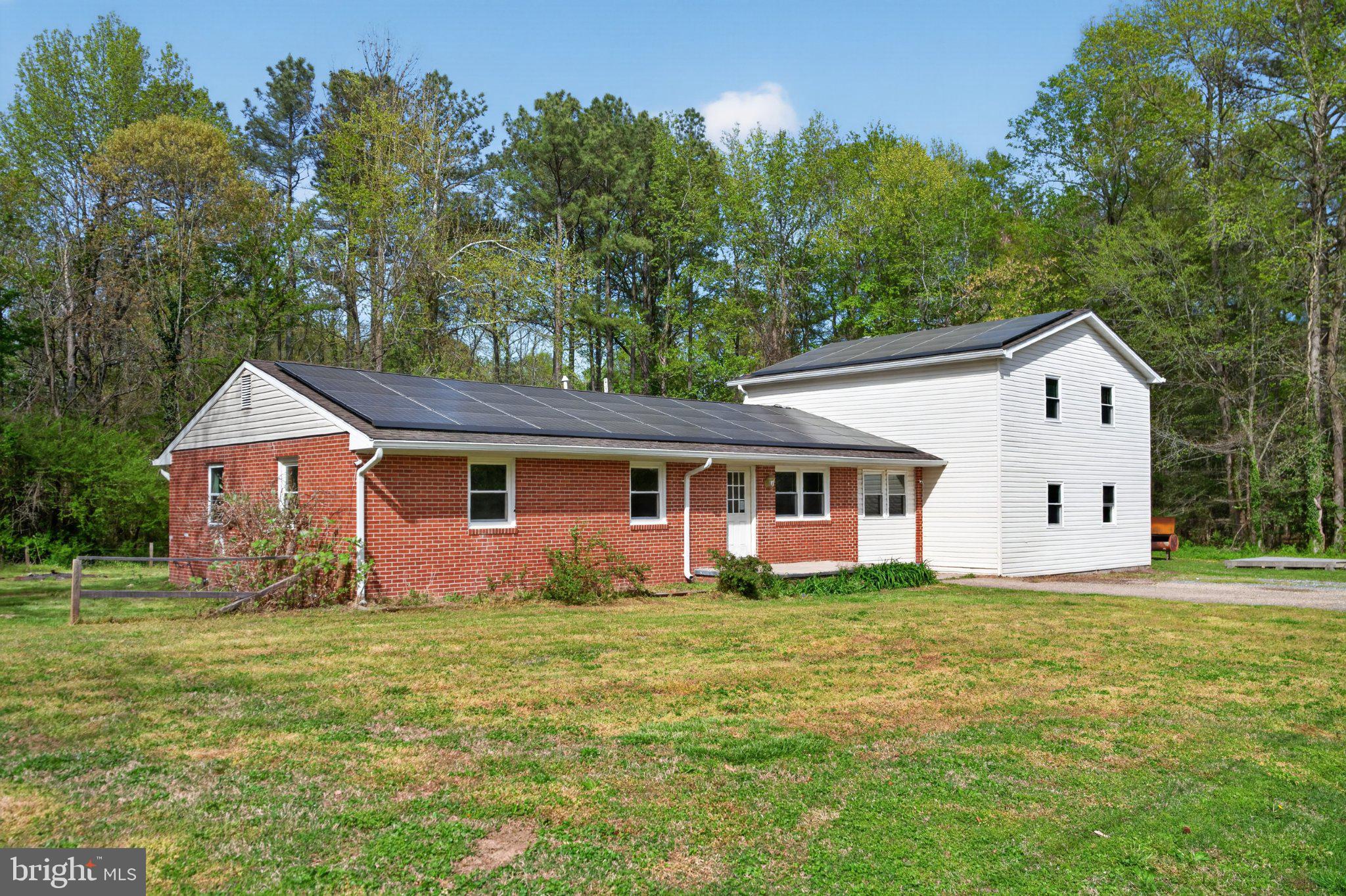 Charming dual-level home in nature's embrace.