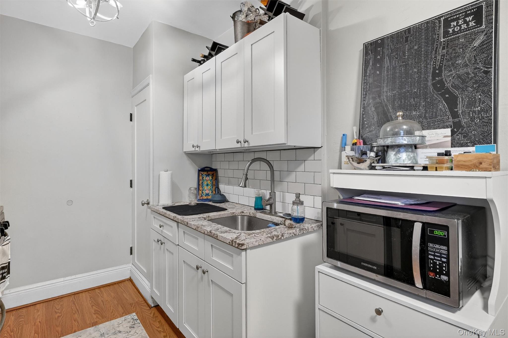 475 Bronx River Road, Unit 2D Yonkers, NY 10704 - Photo 14 of 27 a kitchen with granite countertop a sink stove and cabinets