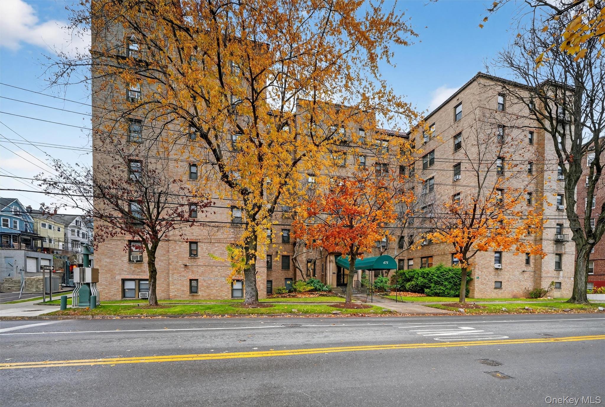 475 Bronx River Road, Unit 2D Yonkers, NY 10704 - Photo 2 of 27 front view of a building with a road
