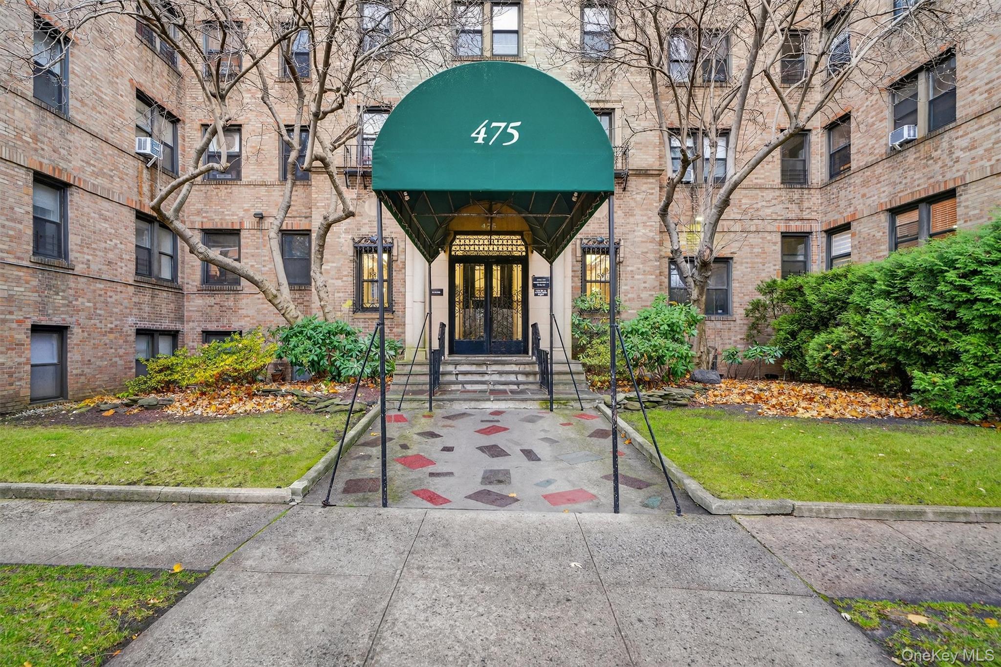 475 Bronx River Road, Unit 2D Yonkers, NY 10704 - Photo 3 of 27 a front view of a house with garden