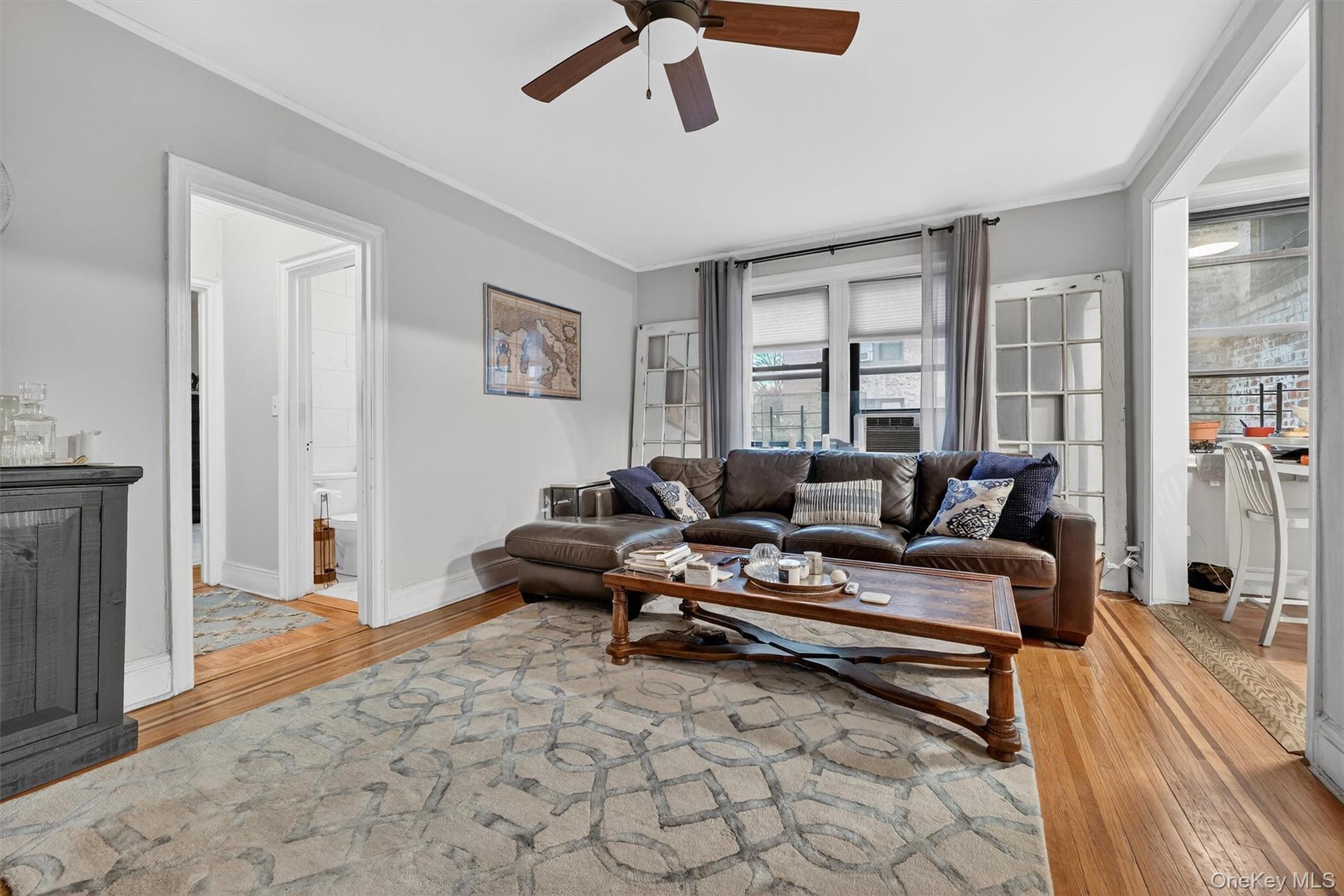 475 Bronx River Road, Unit 2D Yonkers, NY 10704 - Photo 7 of 27 a living room with furniture and a rug