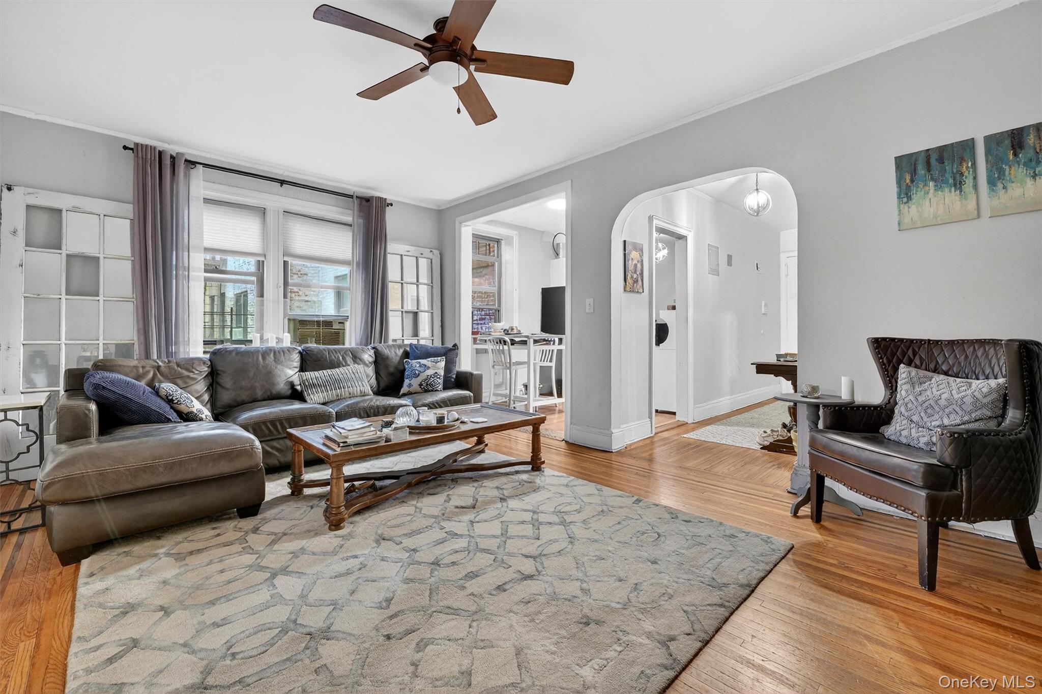 475 Bronx River Road, Unit 2D Yonkers, NY 10704 - Photo 8 of 27 a living room with furniture and wooden floor