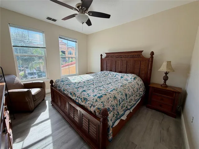 a bedroom with a bed and window