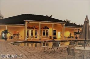 27103 Matheson Avenue, Unit 103 Bonita Springs, FL 34135 - Photo 21 of 29 View of swimming pool featuring a patio