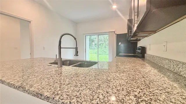 a view of a bathroom from a corridor