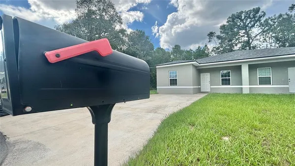 a backyard of a house with seating space