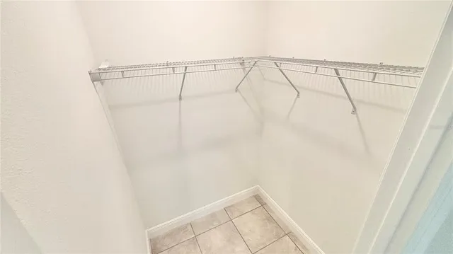 a bathroom with a granite countertop shower