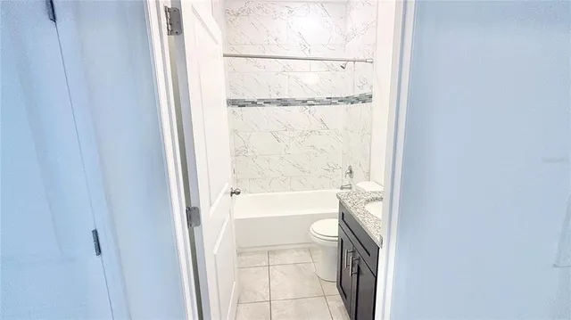 a bathroom with a bathtub and shower