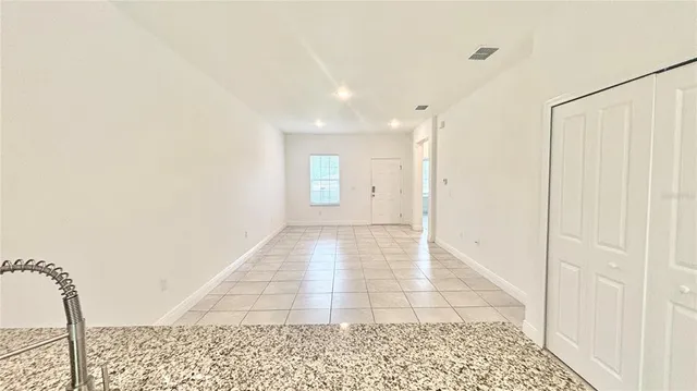 a view of a hallway with a window