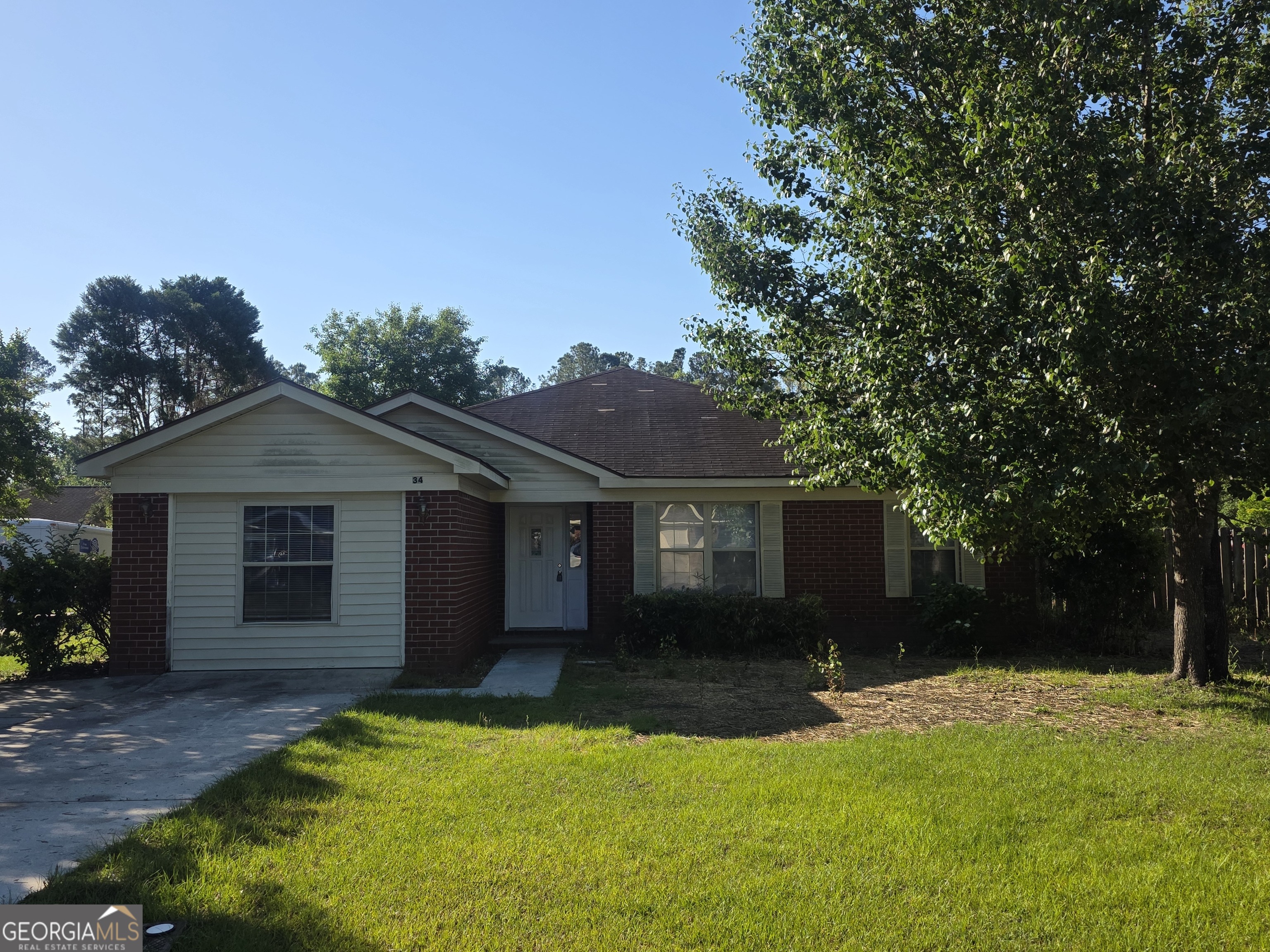 34 Walnut Way Rincon, GA 31326 - Photo 1 of 1 front view of a house with a yard