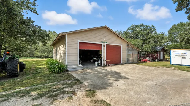 a view of yard with swimming pool and trees