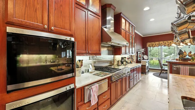a kitchen with a stove and a sink