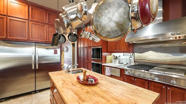 a dining room with furniture and a large window