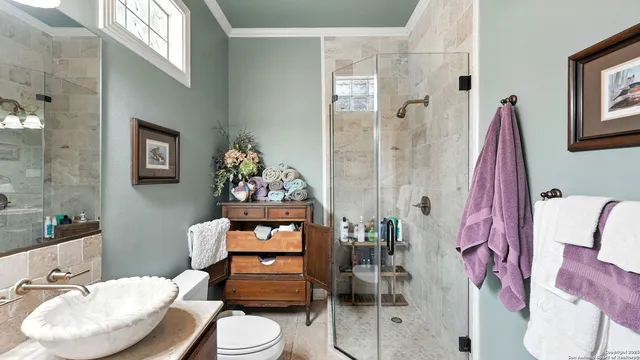 a livingroom with lounge chair and a window