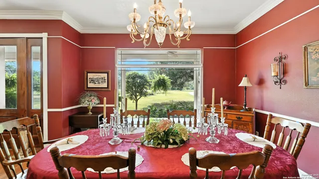a view of a dining room with furniture window and outside view