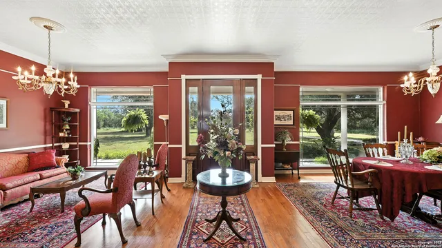 a backyard of a house with a yard and outdoor seating