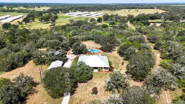 an aerial view of residential houses with outdoor space