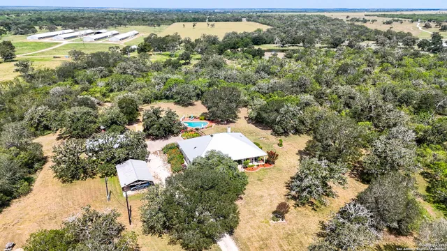 an aerial view of residential house with outdoor space