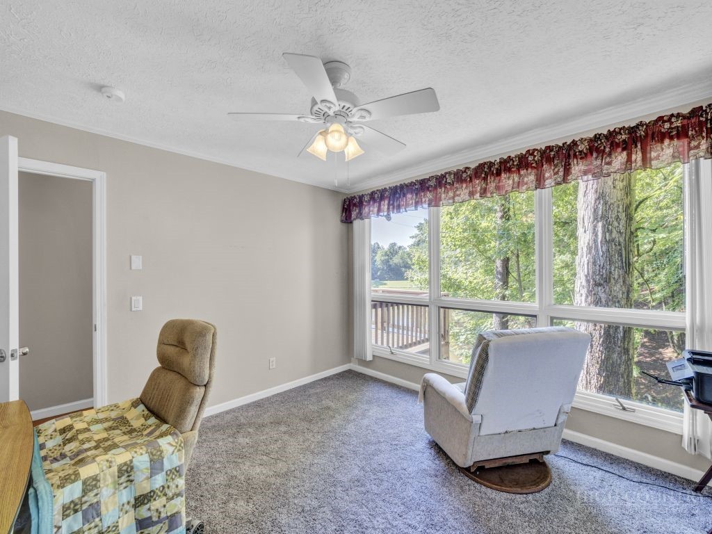 265 Trout Lake Road Deep Gap, NC 28618 - Photo 27 of 50 a living room with furniture and a large window