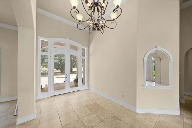 a view of an entryway with a chandelier