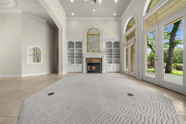 a view of a kitchen with a sink and a fireplace