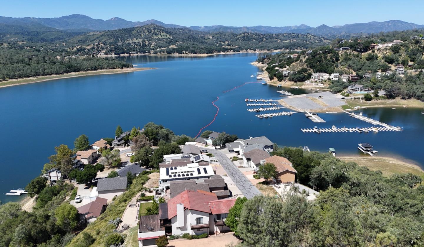 an aerial view of a house with a lake view