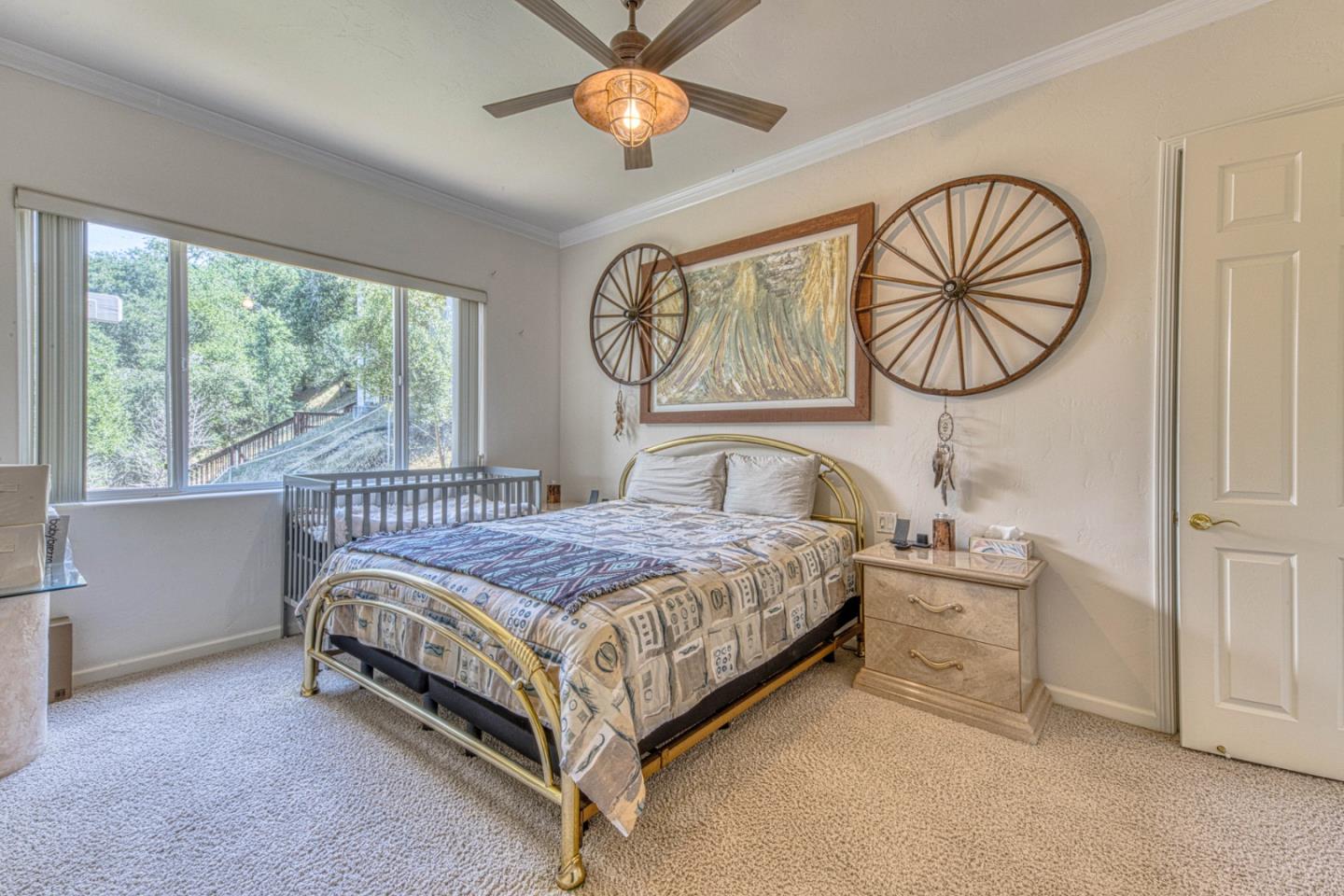 8213 Bass Point Road Bradley, CA 93426 - Photo 38 of 58 a bedroom with a bed and a chandelier