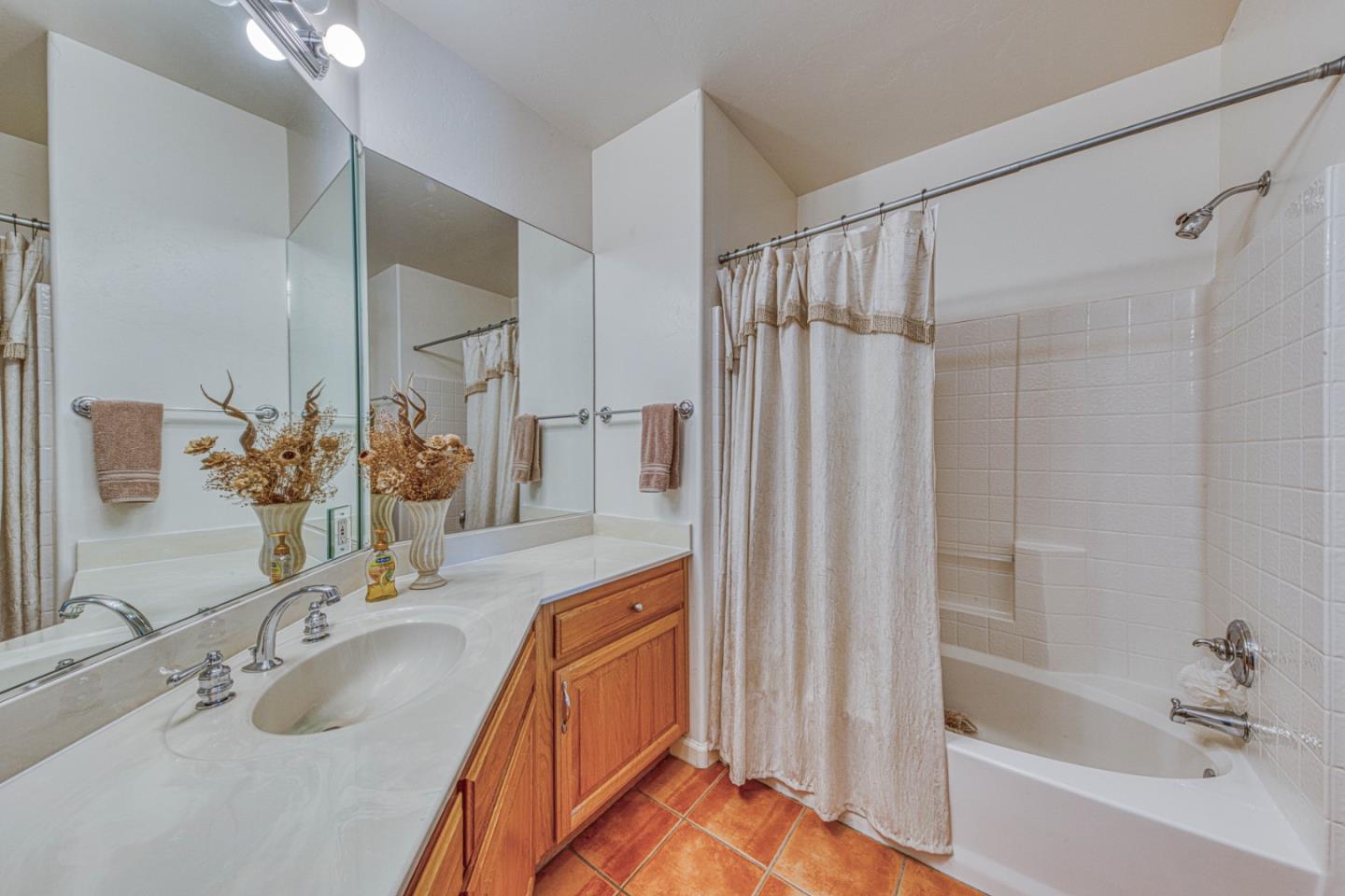 8213 Bass Point Road Bradley, CA 93426 - Photo 42 of 58 a bathroom with a tub sink and mirror