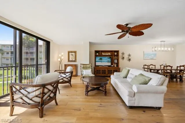 a kitchen with stainless steel appliances granite countertop a stove a sink a microwave and a refrigerator