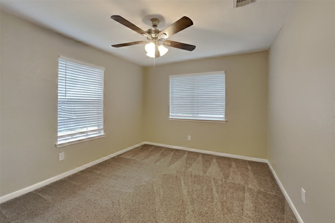 16411 Willingham Way Houston, TX 77095 - Photo 12 of 21 a view of an empty room with a window