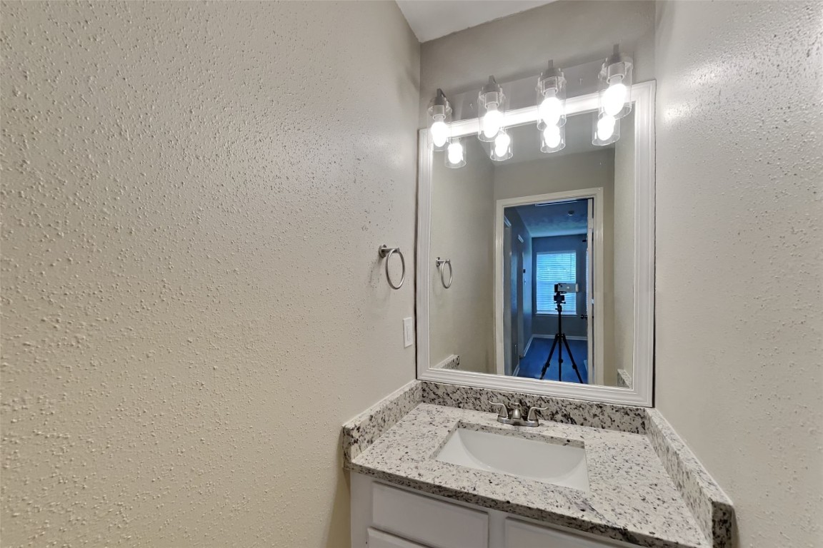 16411 Willingham Way Houston, TX 77095 - Photo 15 of 21 a bathroom with a granite countertop sink and a mirror