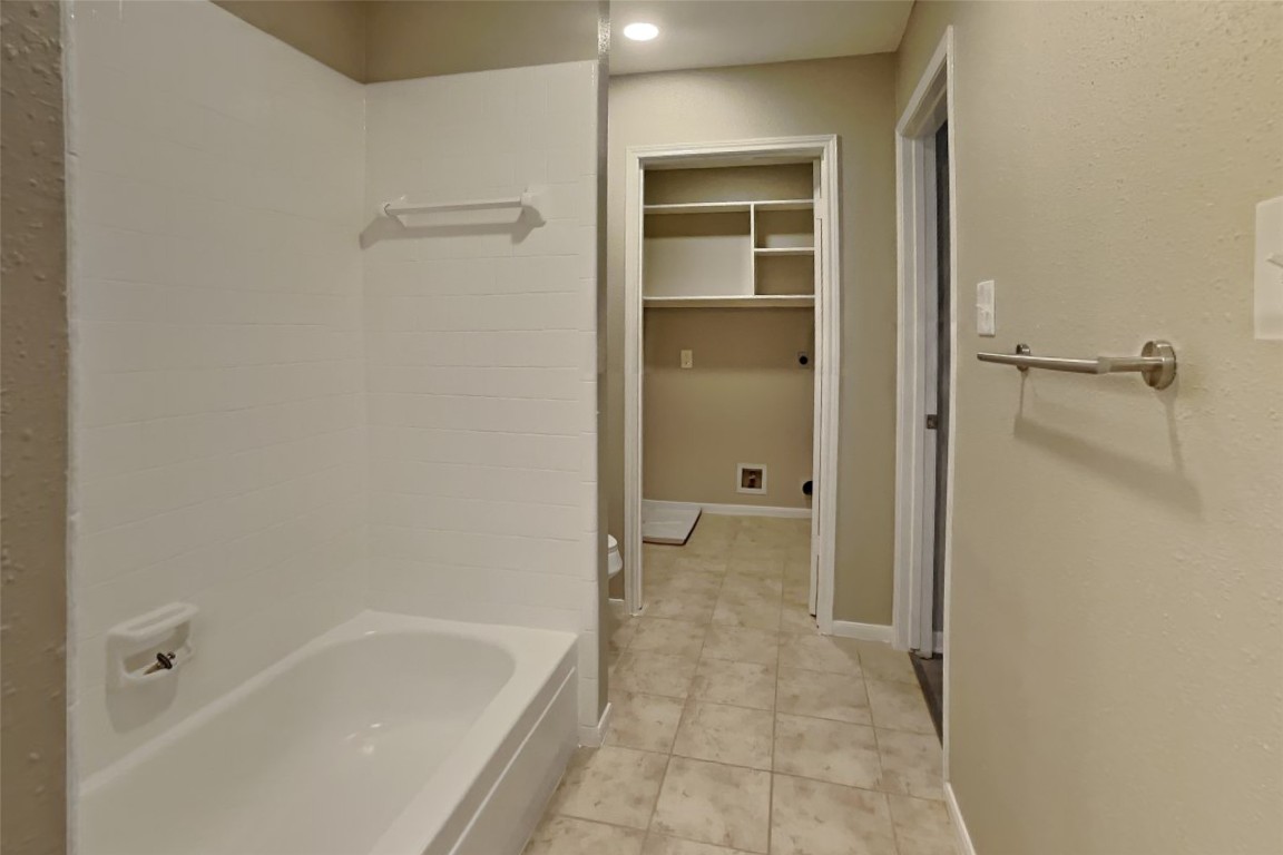 16411 Willingham Way Houston, TX 77095 - Photo 16 of 21 a bathroom with a bathtub and a shower