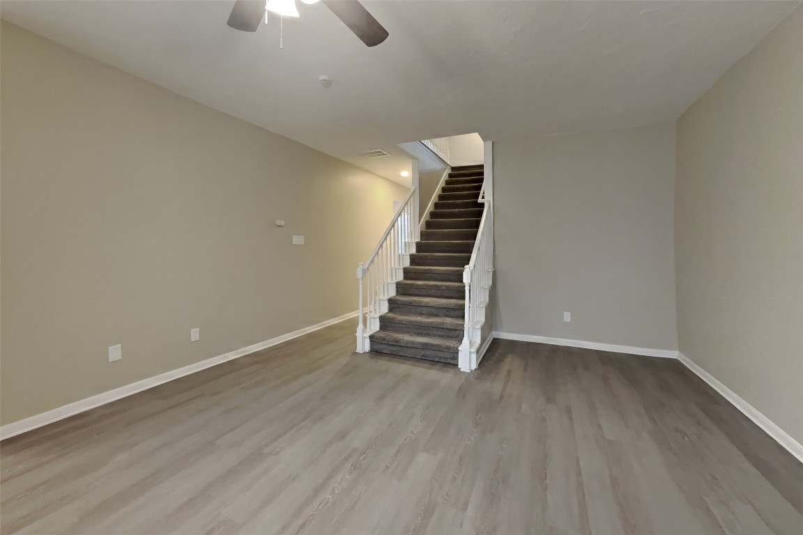 16411 Willingham Way Houston, TX 77095 - Photo 2 of 21 a view of an empty room with stairs and ventilation