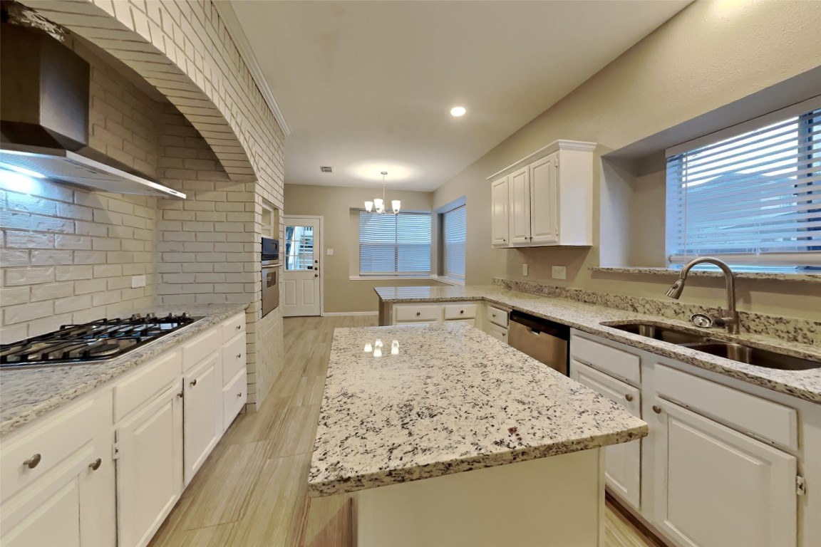 16411 Willingham Way Houston, TX 77095 - Photo 5 of 21 a kitchen with stainless steel appliances granite countertop a sink stove and cabinets