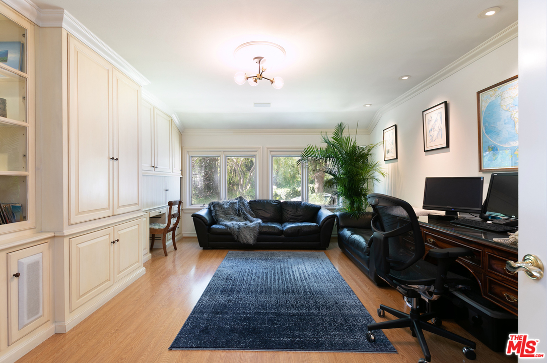 10935 Alta View Drive Studio City, CA 91604 - Photo 16 of 45 a living room with furniture a rug and a flat screen tv