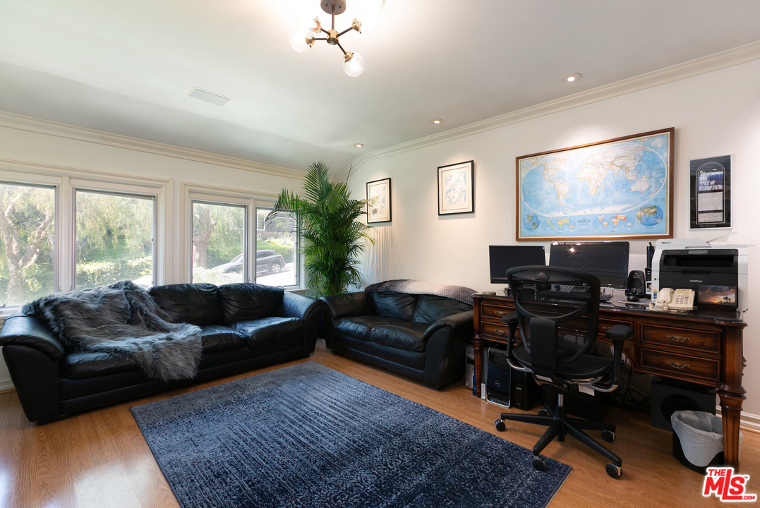 10935 Alta View Drive Studio City, CA 91604 - Photo 18 of 45 a living room with furniture and a flat screen tv