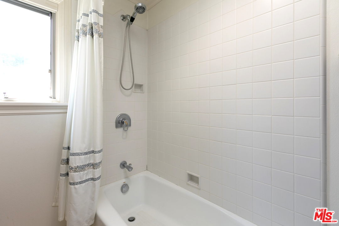 10935 Alta View Drive Studio City, CA 91604 - Photo 30 of 45 a bathroom with a bath tub with a shower