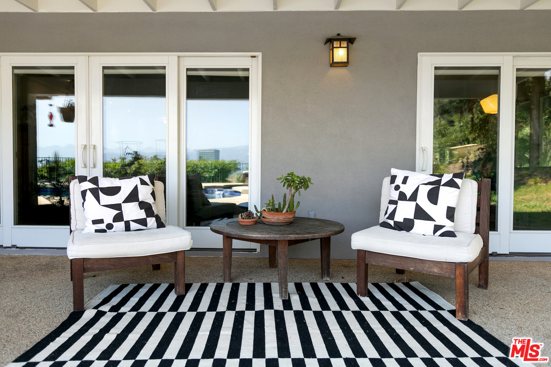 10935 Alta View Drive Studio City, CA 91604 - Photo 36 of 45 a living room with furniture rug and window